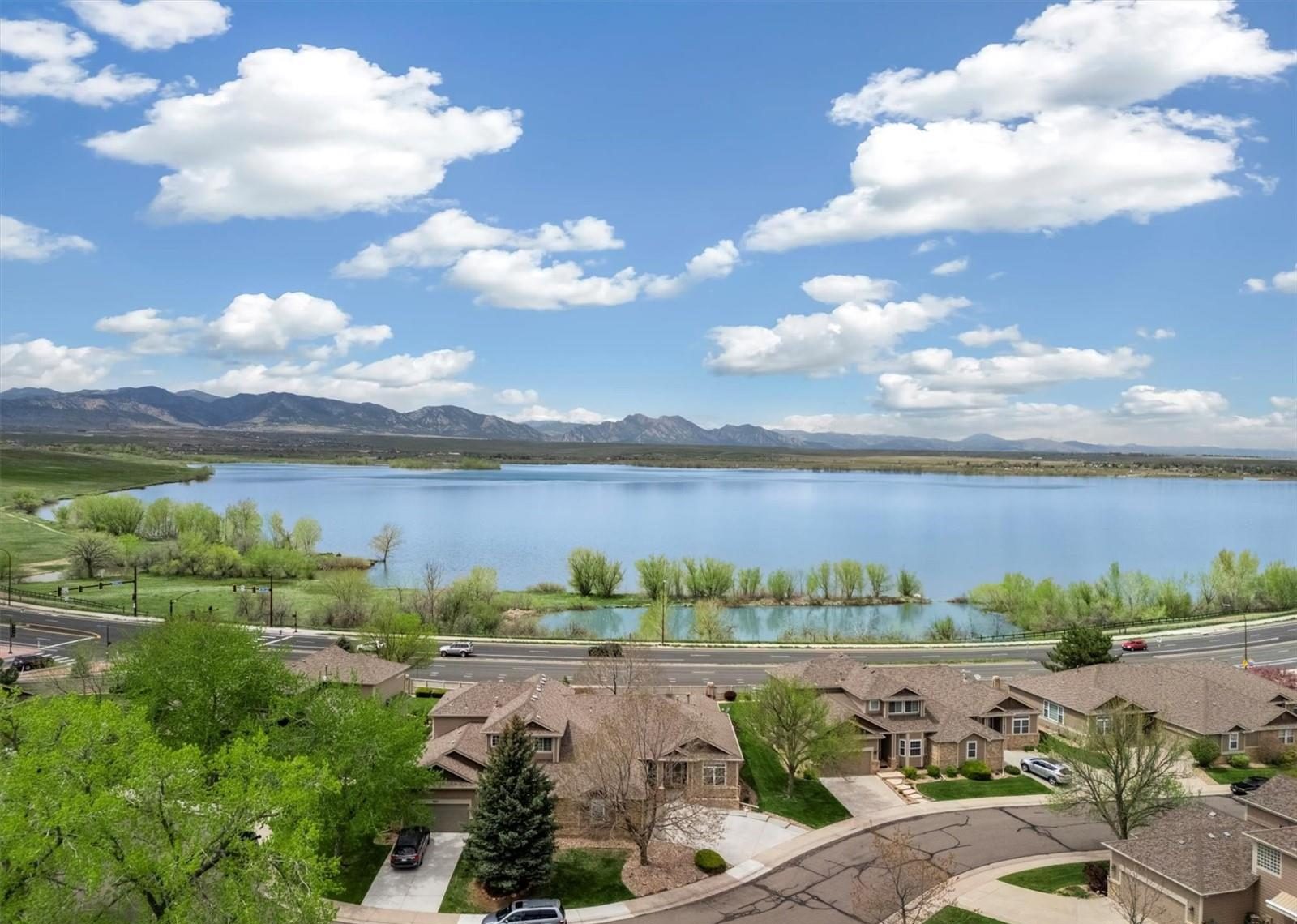 Aerial view of Standley Lake in Westminster, with homes along its shore and the foothills beyond.