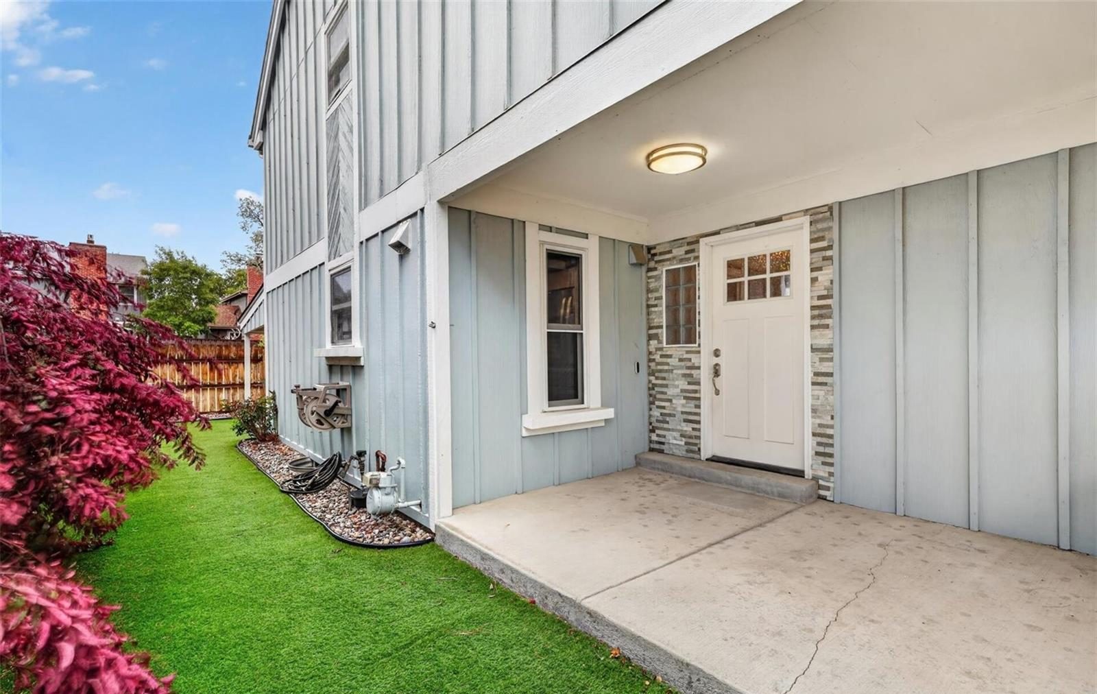 Front entry with a board-and-batten wall at an Arvada home.