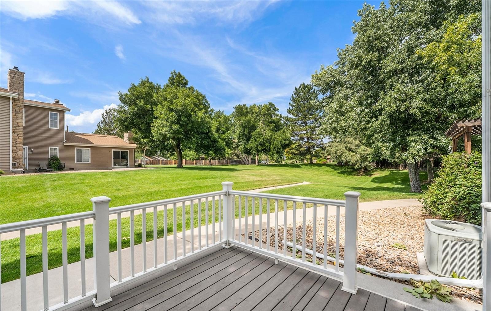 Deck and shared lawn at an Arvada townhome.