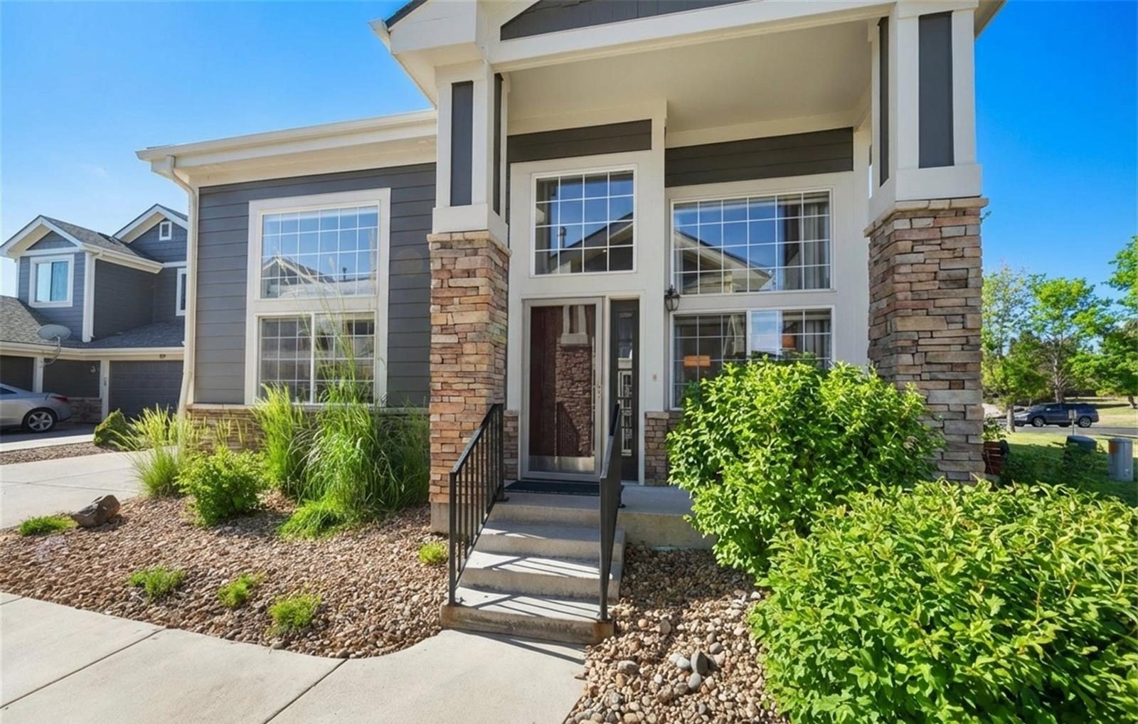Townhome with a stone-accented porch in Broomfield.