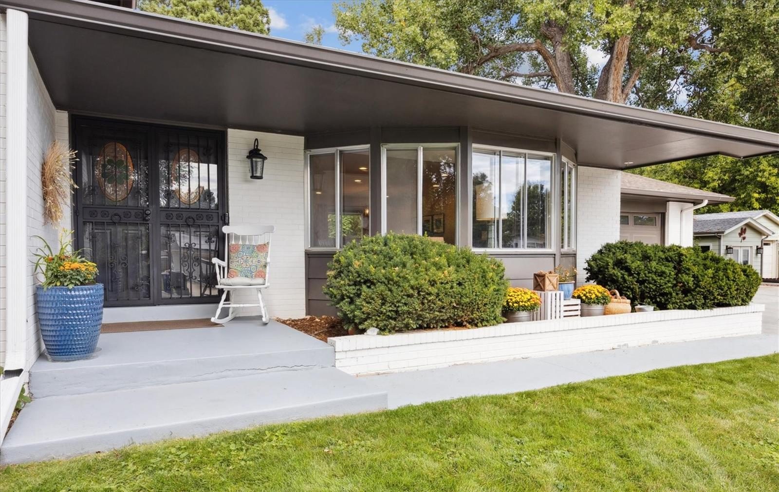 Covered front porch of a mid-century home.