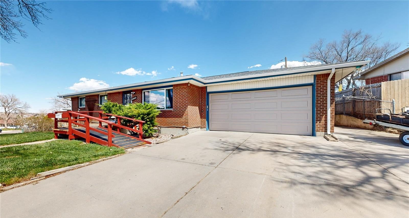 Brick ranch home with a two-car garage in Denver.