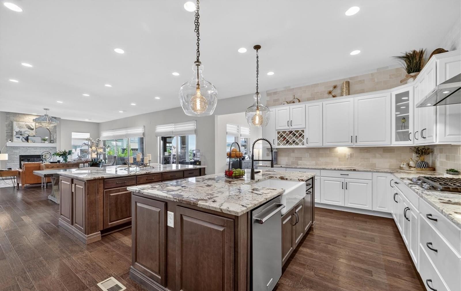 Bright white kitchen with a large island in a newer home.