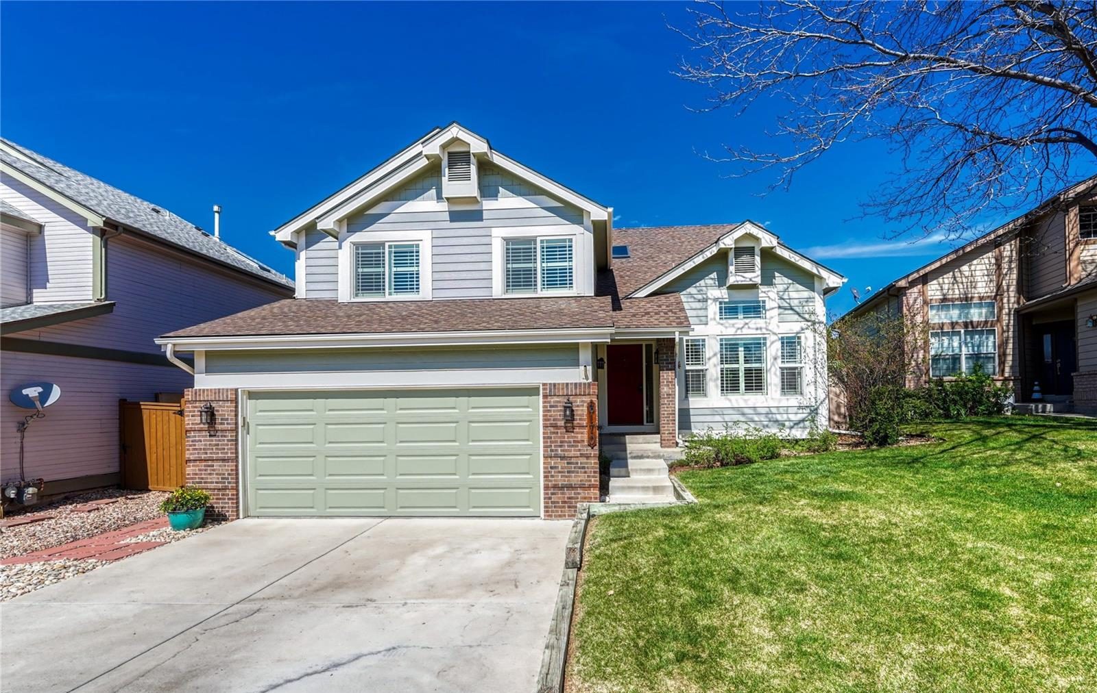 Two-story craftsman home with a gabled porch.