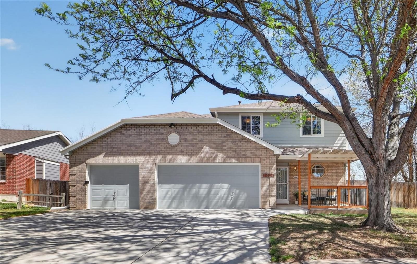 Brick two-story home with a two-car garage in central Broomfield.