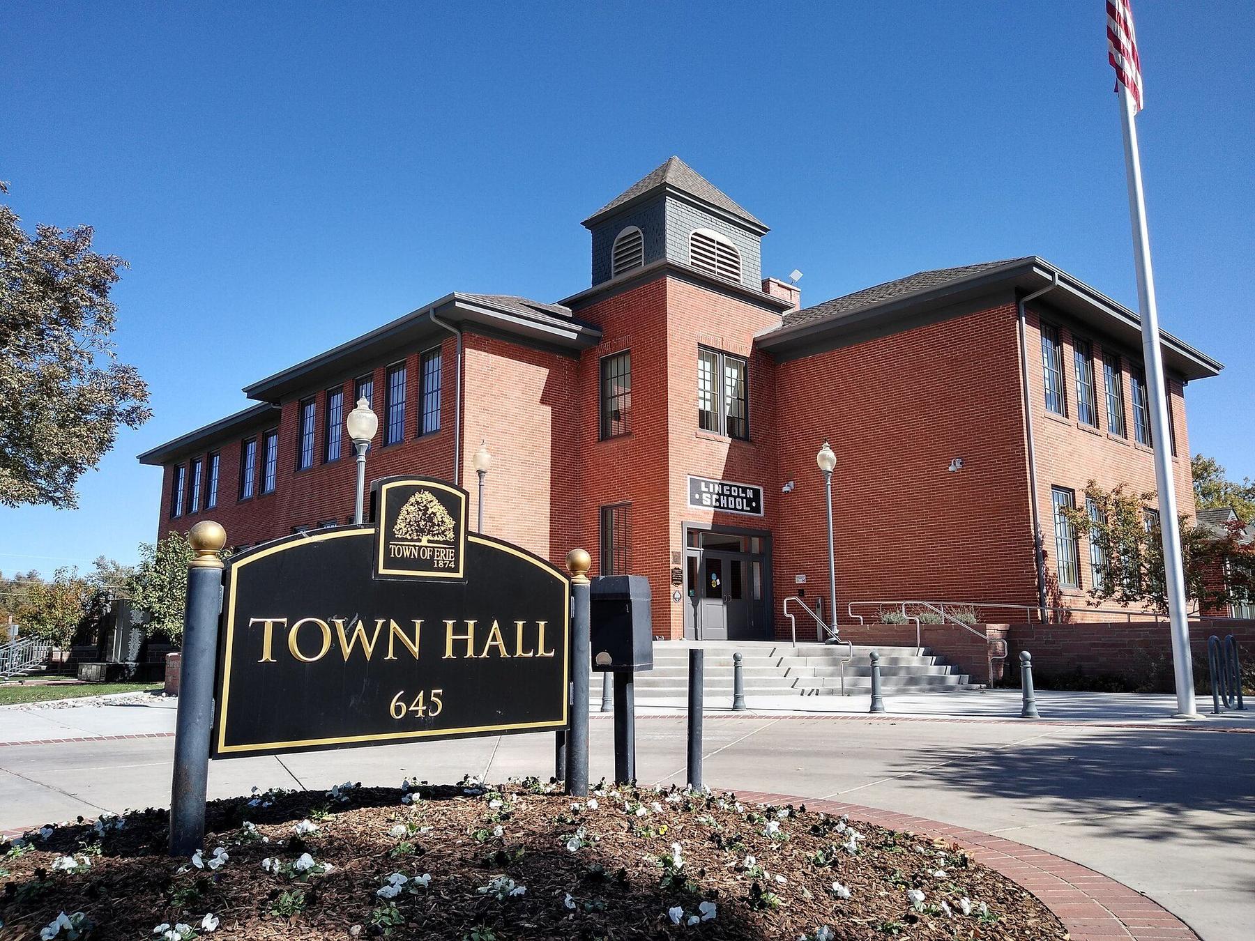 Erie Town Hall, a historic red-brick building with a town hall sign.