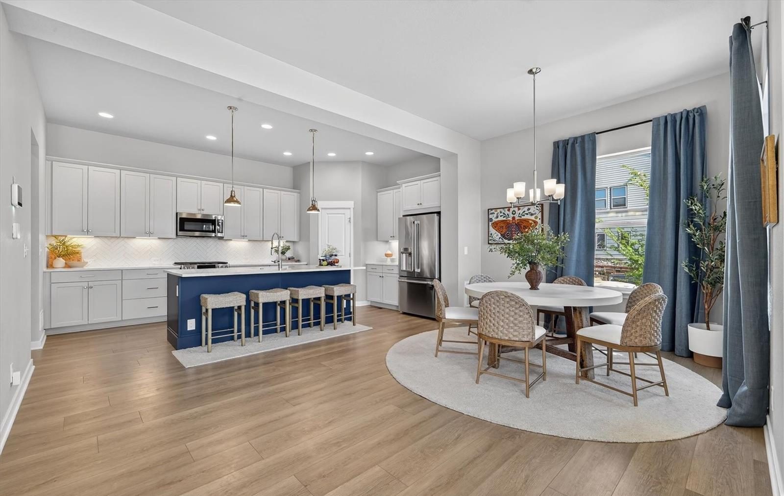 Bright open kitchen and dining area in a Broomfield home.