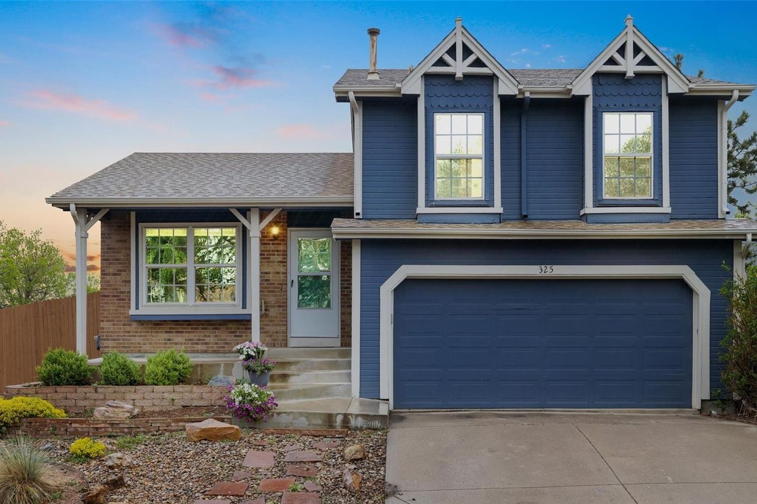 A two-story home in Greenway Park at dusk.