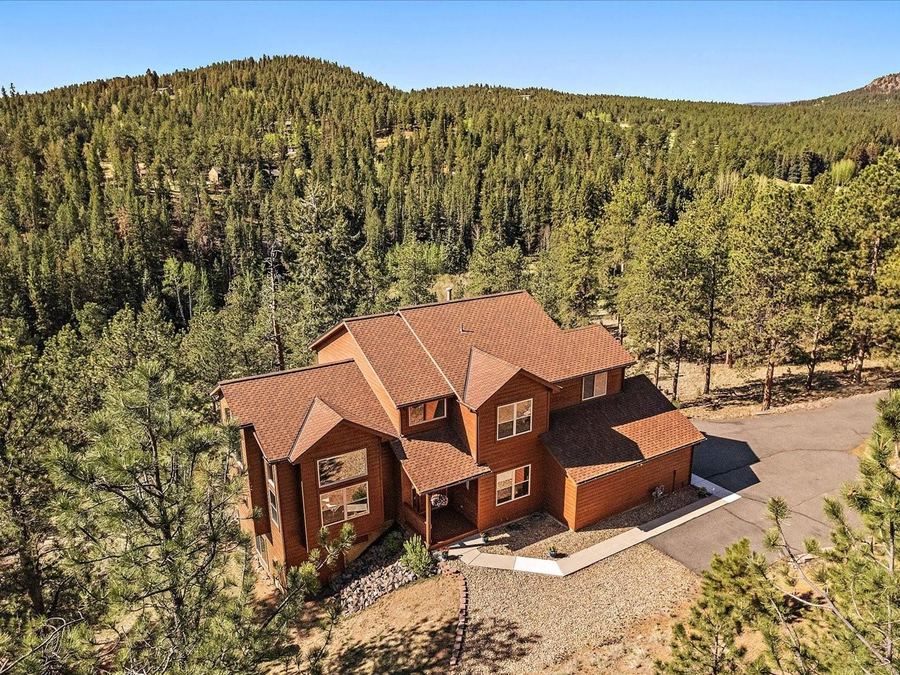 Front of 44 Woodside Circle, Pine, Colorado, sold by Steve Calley.