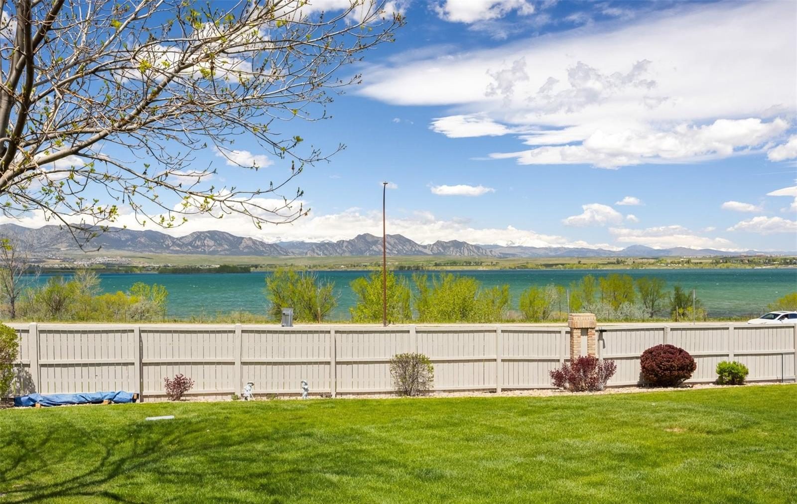 Standley Lake in Westminster, with the foothills beyond a backyard fence.