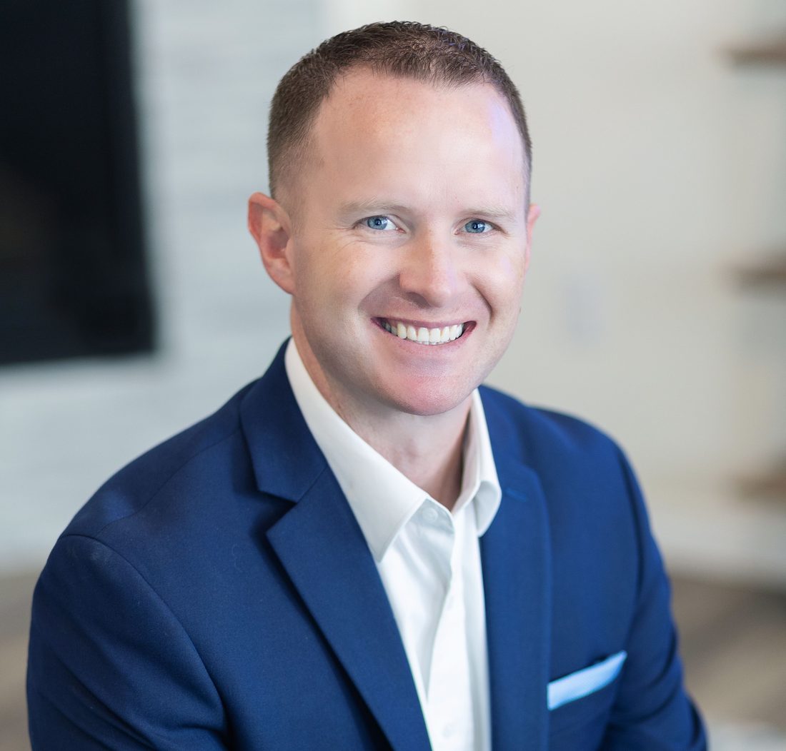 Headshot of Steve Calley in a navy blazer, smiling.