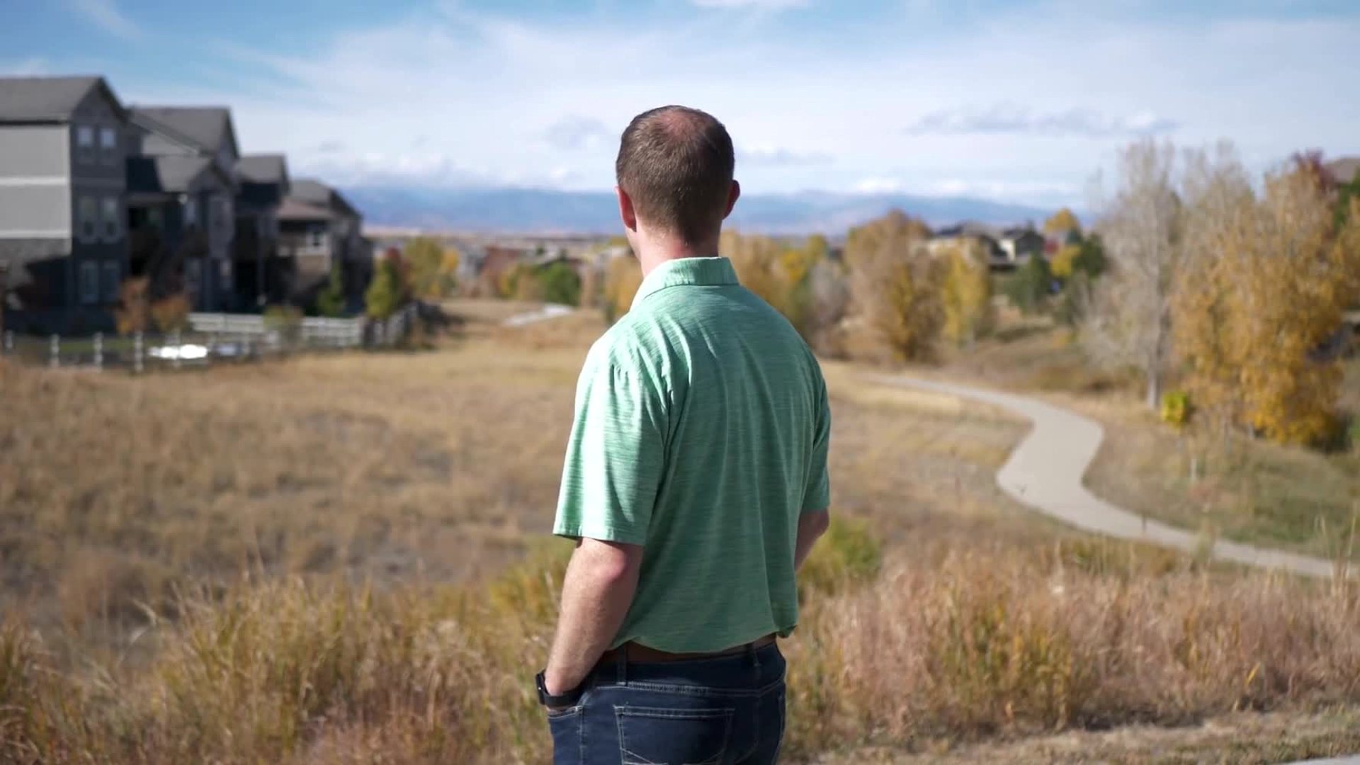 Steve Calley looking out over open space toward the Front Range.