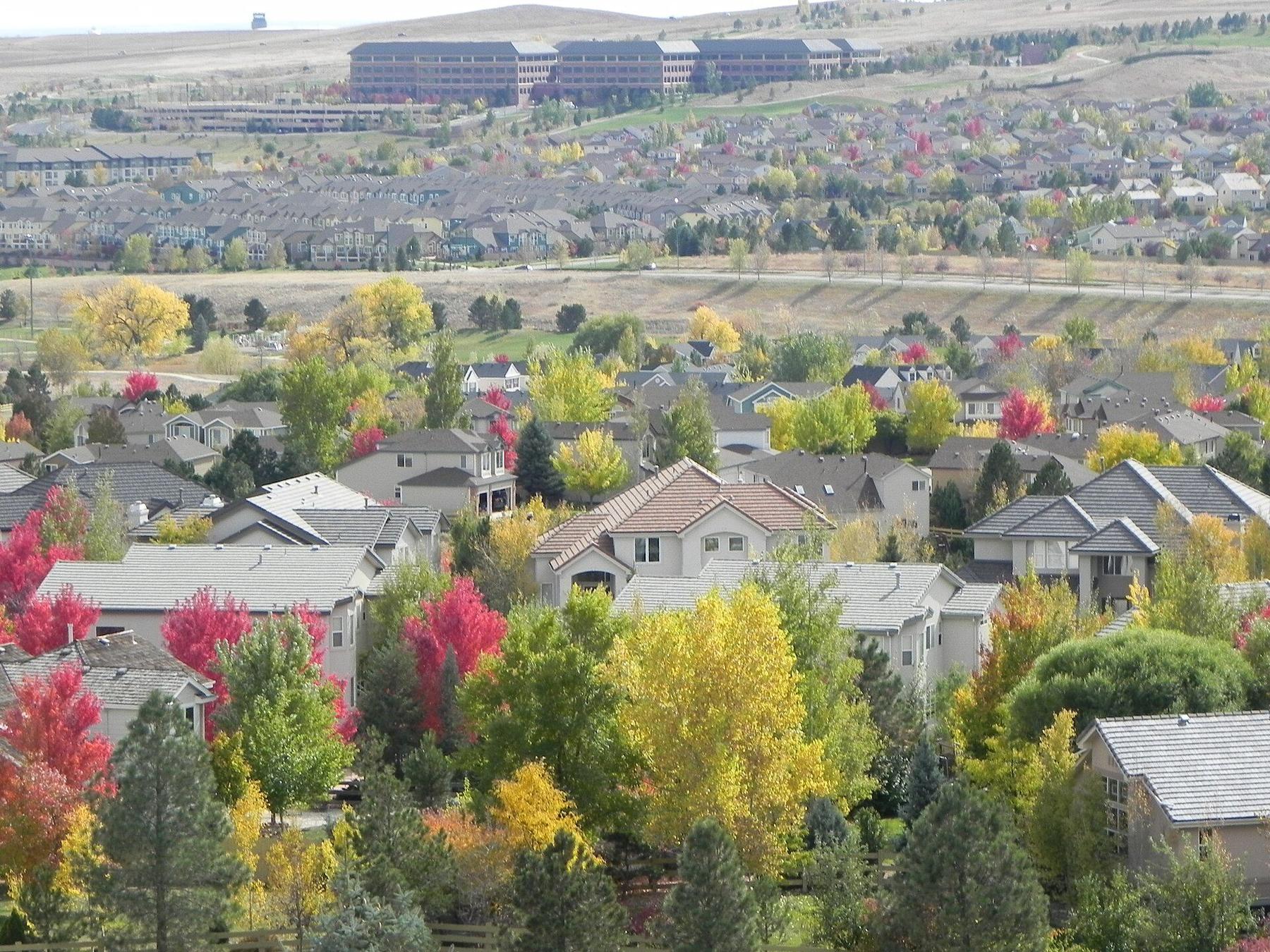 Homes among fall trees in Superior, Colorado, photographed in 2011.