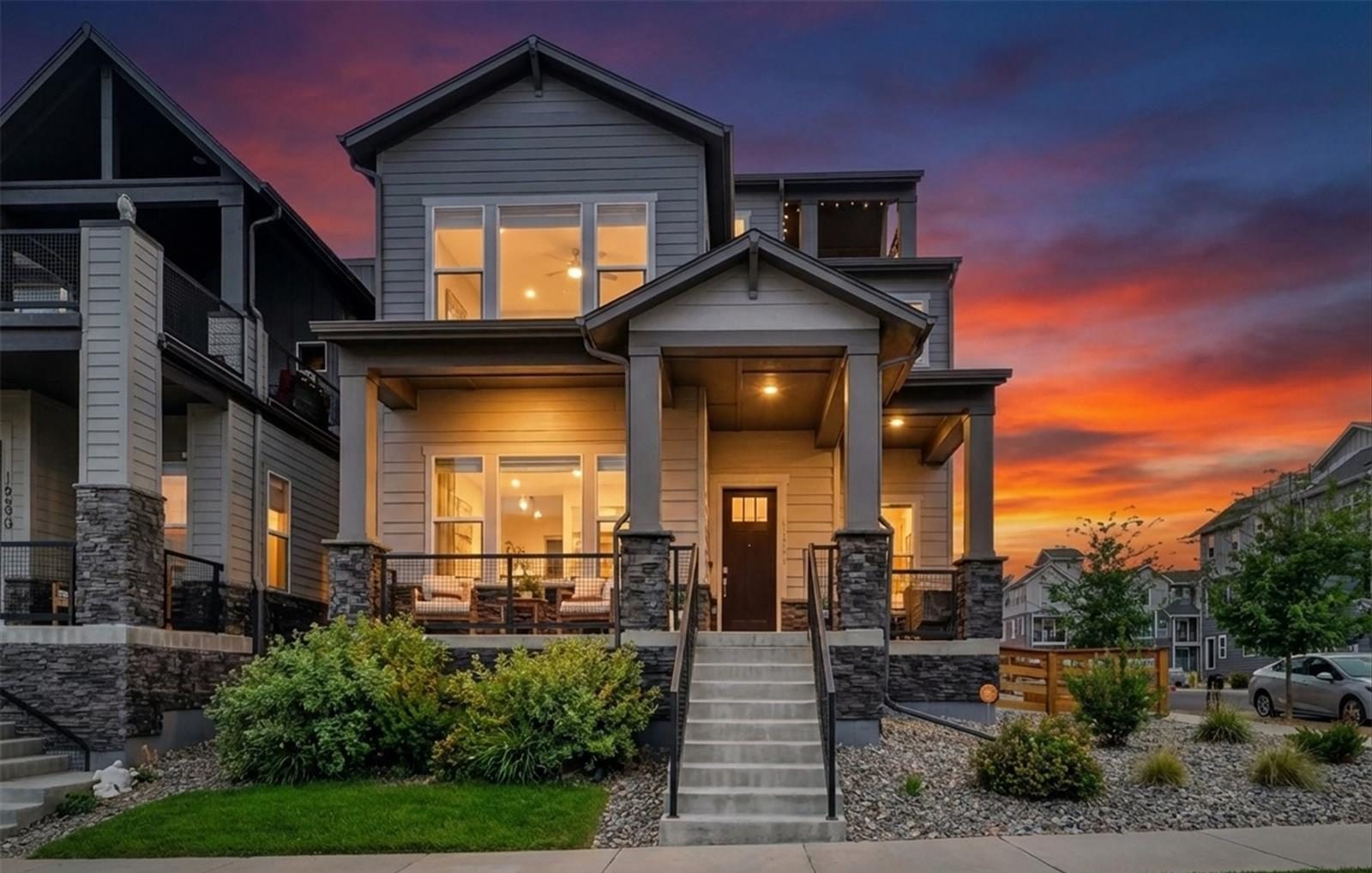 Three-story home with a covered front porch on Tejon Lane in Broomfield at twilight, sold by Steve Calley.